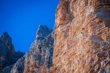 The Tre Cime di Lavaredo also called the Drei Zinnen are three distinctive battlement-like peaks, in the Sexten Dolomites of northeastern Italy.
