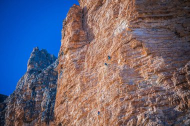The Tre Cime di Lavaredo also called the Drei Zinnen are three distinctive battlement-like peaks, in the Sexten Dolomites of northeastern Italy.