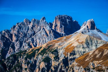 The Tre Cime di Lavaredo also called the Drei Zinnen are three distinctive battlement-like peaks, in the Sexten Dolomites of northeastern Italy.