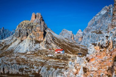 The Tre Cime di Lavaredo also called the Drei Zinnen are three distinctive battlement-like peaks, in the Sexten Dolomites of northeastern Italy.