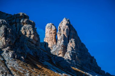 The Tre Cime di Lavaredo also called the Drei Zinnen are three distinctive battlement-like peaks, in the Sexten Dolomites of northeastern Italy.
