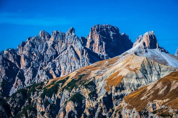 The Tre Cime di Lavaredo also called the Drei Zinnen are three distinctive battlement-like peaks, in the Sexten Dolomites of northeastern Italy.
