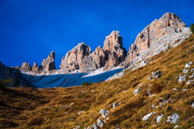 The Tre Cime di Lavaredo also called the Drei Zinnen are three distinctive battlement-like peaks, in the Sexten Dolomites of northeastern Italy.