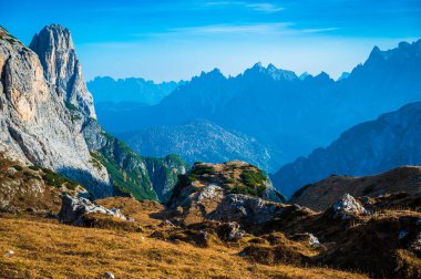 The Tre Cime di Lavaredo also called the Drei Zinnen are three distinctive battlement-like peaks, in the Sexten Dolomites of northeastern Italy.