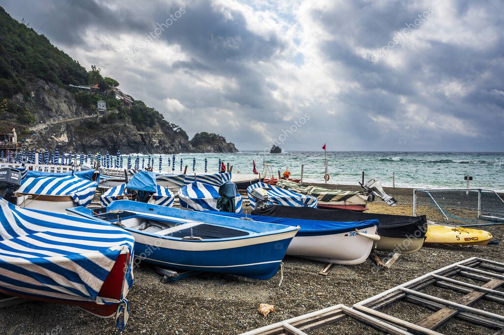 Beautiful view of sea coast with boats. Monterosso, the port, the beach and the ancient village                