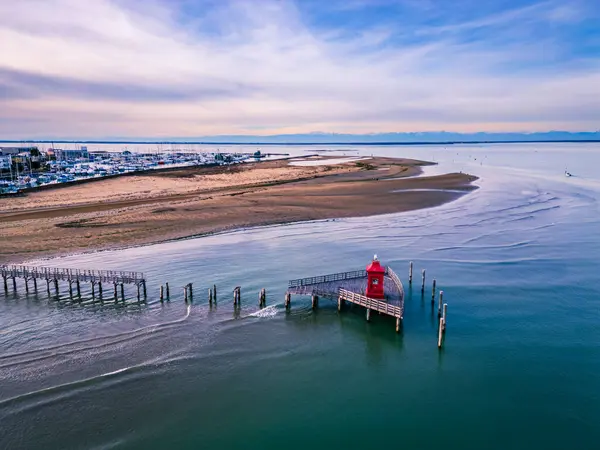 stock image The beach of Lignano Sabbiadoro and its historic lighthouses.