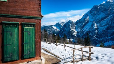 Scenic view of the mountains in Valbruna and Val Saisera at the end of winter. clipart