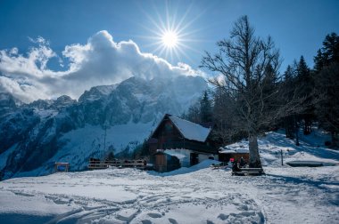 Scenic view of the mountains in Valbruna and Val Saisera at the end of winter. clipart