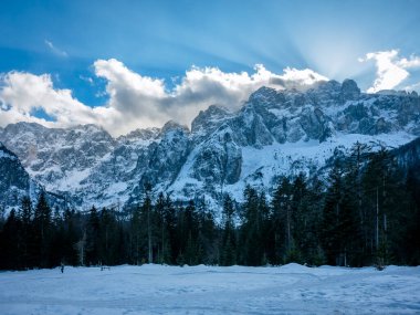 Scenic view of the mountains in Valbruna and Val Saisera at the end of winter. clipart