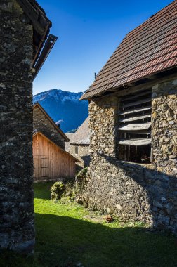 Val Pesarina immersed in autumn atmospheres. Among woods and the ancient Orias stables. clipart