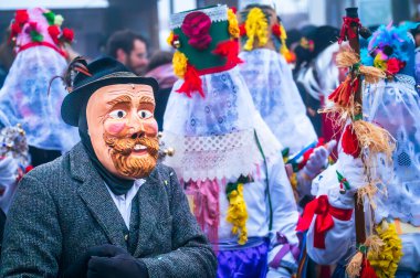 Ancient carnival of Sauris. Traditional wooden masks, Italy on 18 February, 2023 clipart