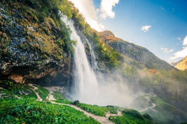  beautiful mountain landscape with waterfall,  Val Raccolana clipart