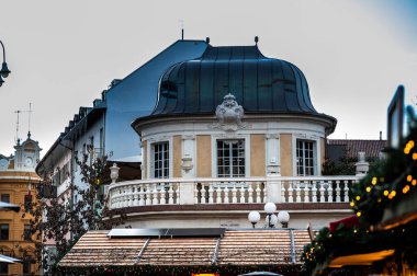 Bolzano between dusk and night. Christmas atmosphere among the historic buildings. Advent. clipart