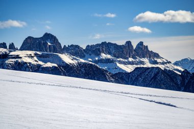 Discovering the Renon plateau in winter. Breathtaking views of the Dolomites. clipart