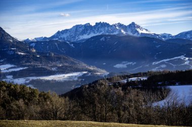 Discovering the Renon plateau in winter. Breathtaking views of the Dolomites. clipart