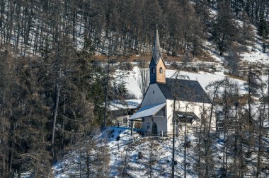 Resia Lake. Curon. The wonder of the Venosta Valley in winter. clipart