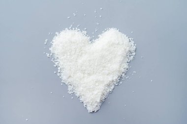 Close up of white soy wax for candle making. Light texture of soy wax flakes. Ingredient for homemade candles. Ecological lifestyle