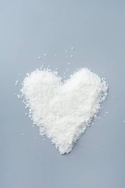 Close up of white soy wax for candle making. Light texture of soy wax flakes. Ingredient for homemade candles. Ecological lifestyle