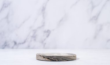 A minimalistic scene of a podium on white background. Round white catwalk for the presentation of products and cosmetics. Showcase with a stage for products, mockup design