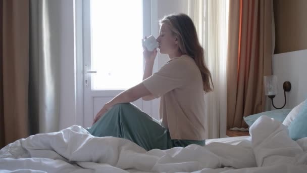 Woman Sitting Bed Hotel Room Drinking Coffee Morning Vacation Concept — Stock Video