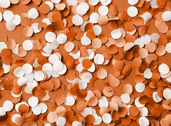Color of the year 2024: Peach Fuzz. 4th of July American Independence Day, colorful circle shape confetti from shredded paper , decorations for fourth july