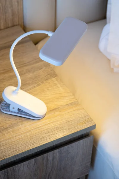 small portable clip lamp for reading. useful device for vacation and trips
