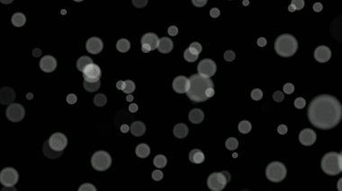 Siyah arkaplan üzerinde beyaz daireler bokeh parçacıkları soyut arkaplan.