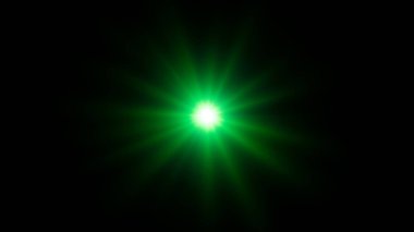 Siyah arkaplanda soyut yeşil yıldız merceği parlaması