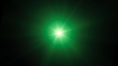 Parlak yeşil yıldız. Parlak soyut yıldız. Soğuk yeşil sihirli patlama.