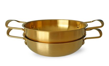 Two stacks of empty golden pot with handles or Korean yellow aluminum pot in modern style isolated on white background with clipping path. Brass Korean Noodle Ramen Pot isolated on white background. clipart