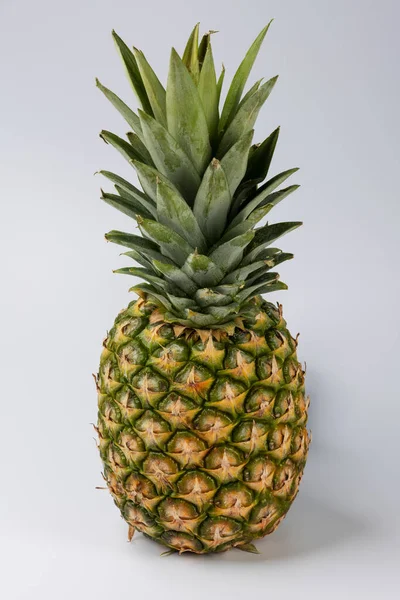 stock image whole pineapple fruit against white background