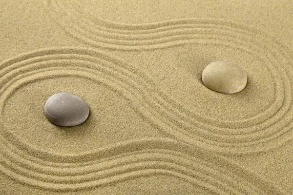 Zen garden with the stones and sand pattern