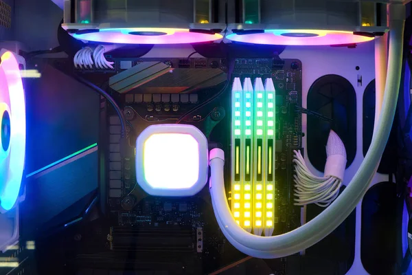 Close-up and inside high performance Desktop PC and Cooling system on CPU socket with multicolored LED RGB light show status on working, interior on Computer PC Case and DIY, technology background