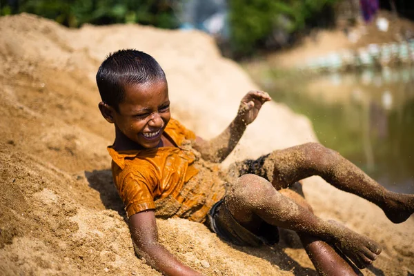 stock image Taherpur, Bangladesh - November 05, 2019: Selective focus of a boy tumbling from a sandhill to the river.