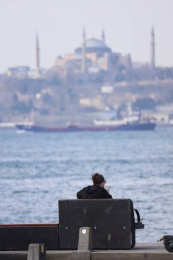 25-02-2023 Istanbul-Turkey: The Woman Who Wrong with the Splendor of the Landscape and the Pain of Loneliness