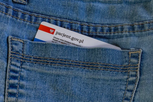 Health insurance card in pocket in blue  jeans pant