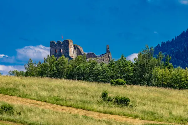 Stock image Restored ruins of the castle in Czorsztyn by the lake, tourist attraction, Instagram place in Poland