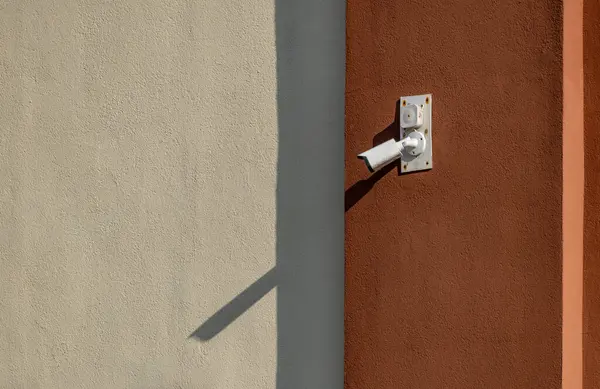 stock image Camera hanging on the wall for video surveillance