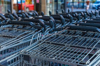 Shopping carts in front of a hypermarket Europe clipart