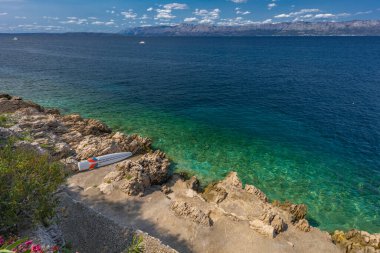 Blue clear water Adriatic sea coast of Croatia Peljesac peninsula Trpan clipart