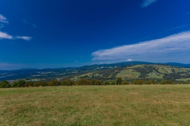 View of the mountains of the Silesian Beskids from the Ochodzita peak, panorama of the Koniakow area clipart