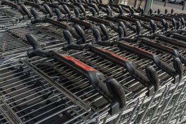 Preparing for shopping, shopping cart, packing purchases into a metal shopping car clipart