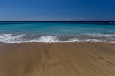 Yellow sand beach, dangerous high waves, Costa Adeje, rough Atlantic Ocean, famous Playa del Duque Teneriffe clipart