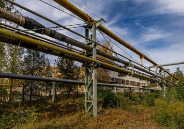 Old rusty pipeline, heating installation, water flow through old pipe clipart