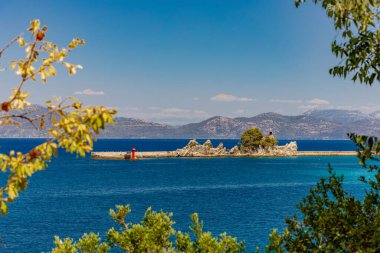 Passenger and cargo port in Trpancia on the Peljesac Peninsula, tourist attraction, place where ships dock, statue of Our Lady of the Whistle of the Se clipart