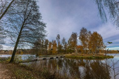 Landscape by the reservoir in Blachownia, a walk around the lake in autumn clipart