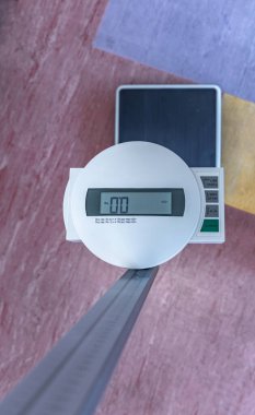 Electronic scale for weighing the weight of newborns and for measuring the child's height clipart