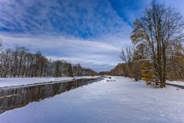 Winter in the mountains, a winter walk, landscape by the Vistula River in Ustron clipart