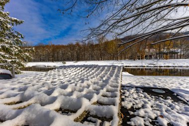 Winter in the mountains, a winter walk, landscape by the Vistula River in Ustron clipart