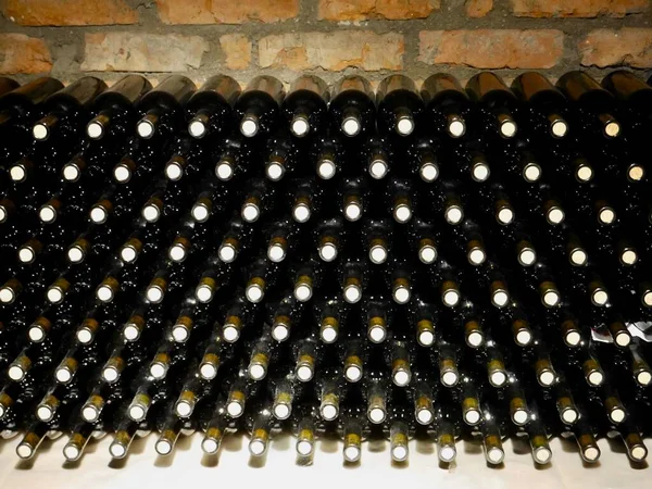 stock image Stacked up wine bottles in wine cellar. High quality photo